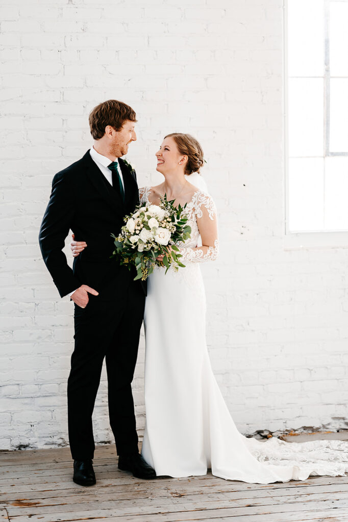 Bride and groom winter wedding portraits at Northern Pacific Center