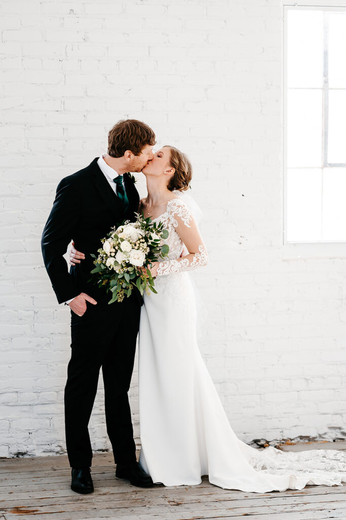 Bride and groom winter wedding portraits at Northern Pacific Center