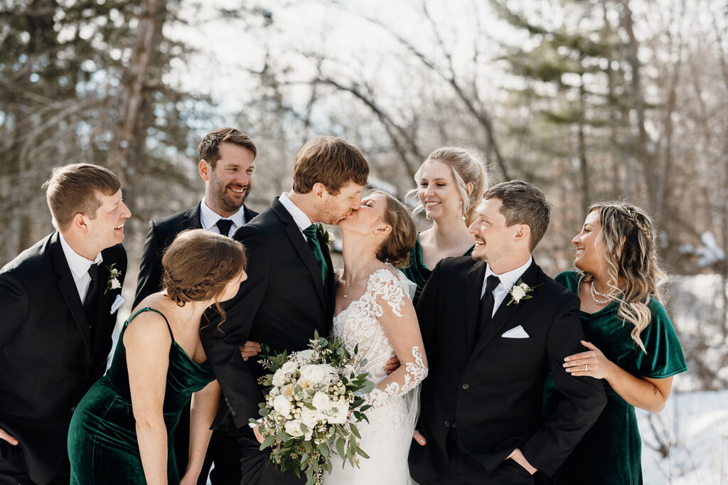 Bride and groom and wedding party in winter