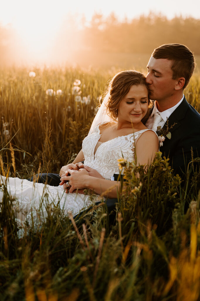 romantic bride and groom wedding photos in a lush field in Minnesota