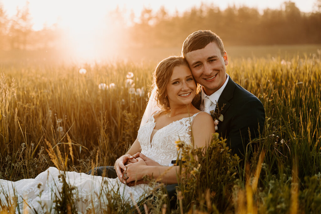 romantic bride and groom golden hour photo in a field