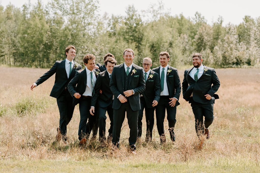 Fun groom and groomsmen photo outdoors