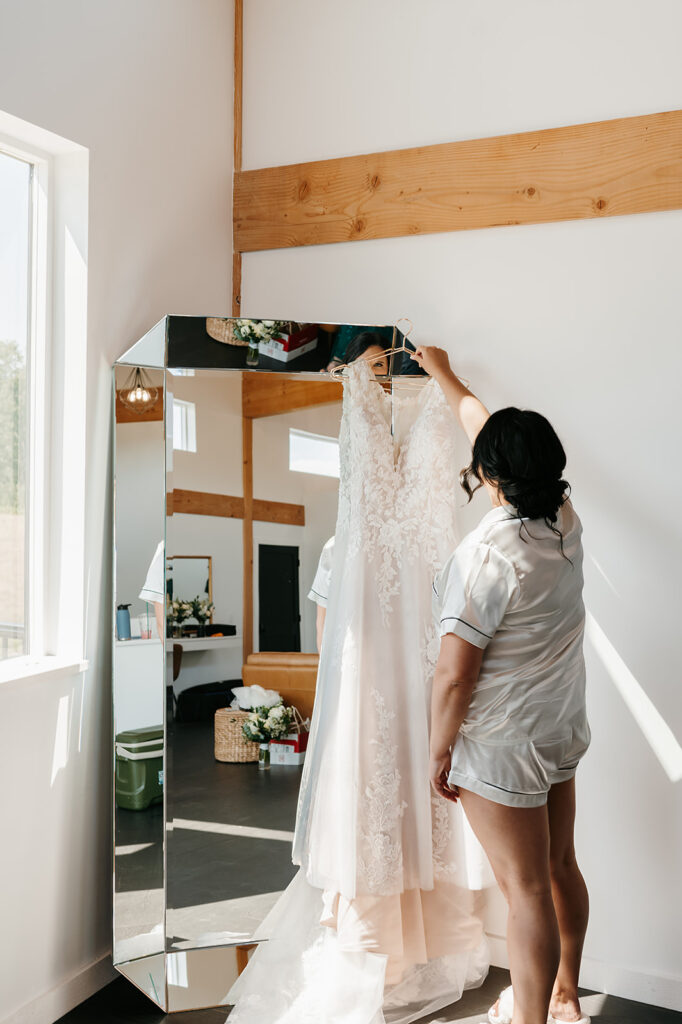 Bride gleaming with joy as she prepares for her special day, surrounded by the elegant decor of the Ivy Black wedding venue