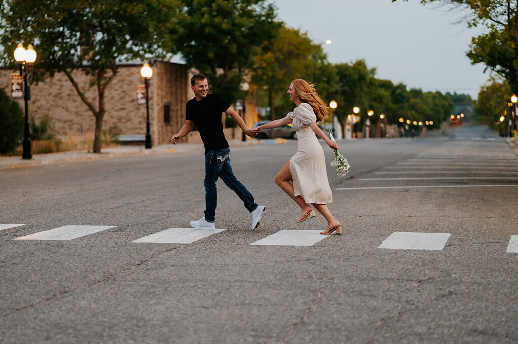 bride and groom sharing playful and intimate moments in downtown Bemidji