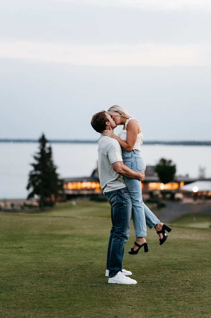 Happy couple posing during blue hour at a beach in Bemidji during their engagement photo session