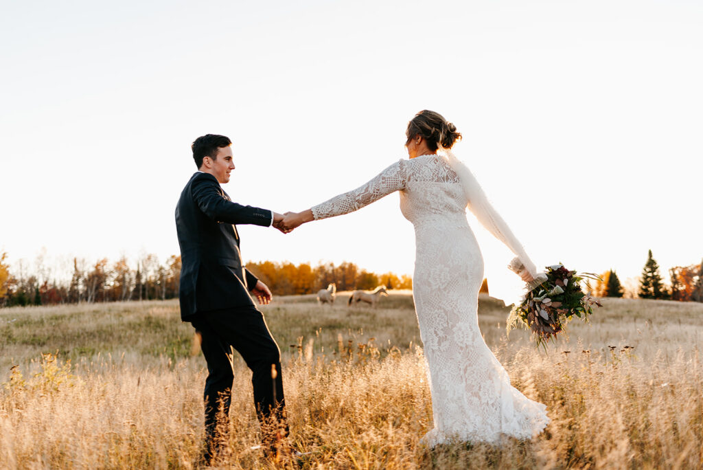 romantic and dreamy bride and groom golden hour wedding photos in a golden field in minnesota