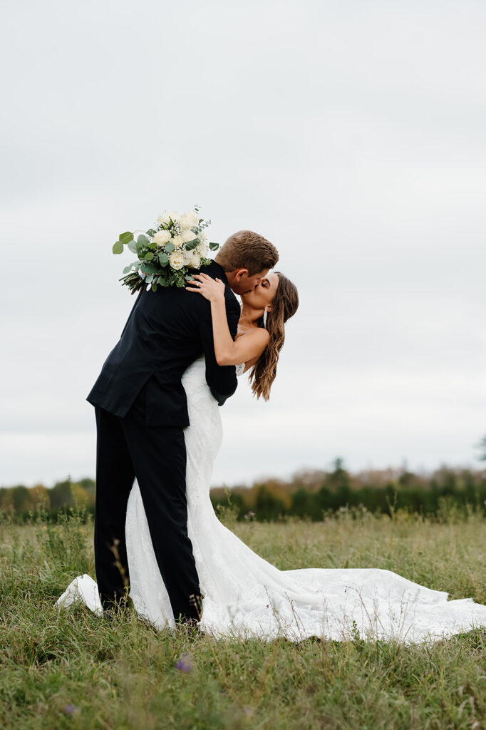 romantic bride and groom outdoor wedding portraits during their late september wedding day
