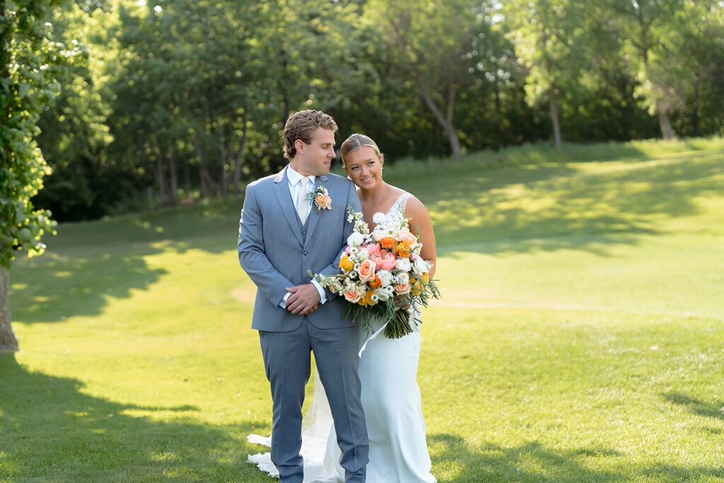 bride and groom portraits on the golf course at bemidji country club