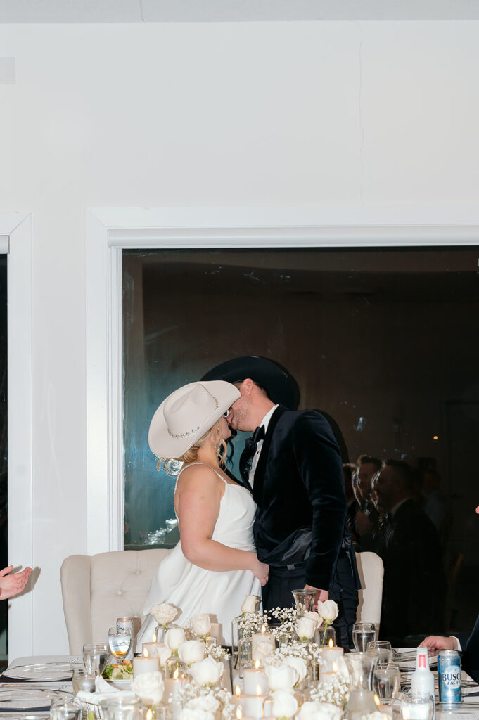 bride and groom kissing during the reception at the Aisling