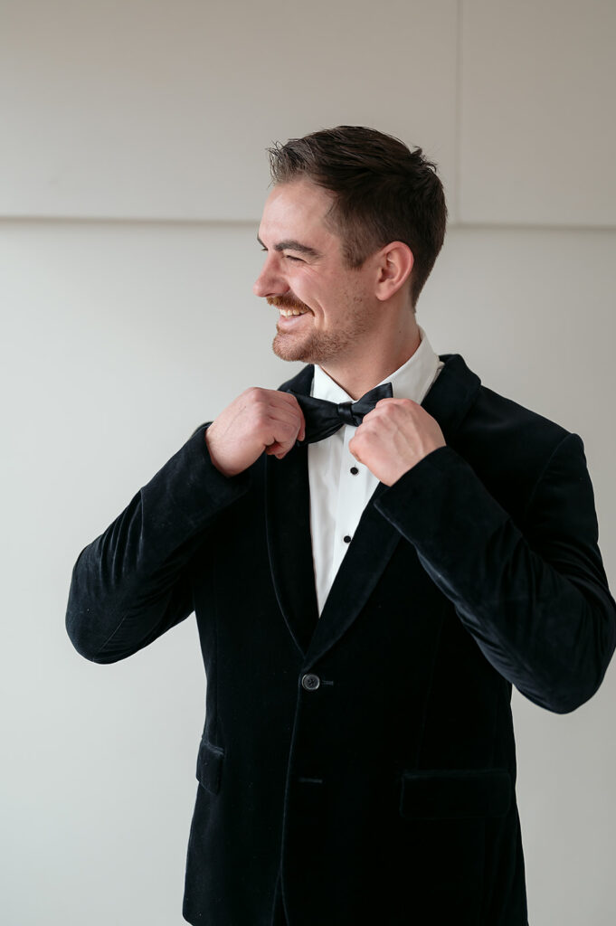 smiling groom getting ready for the big day