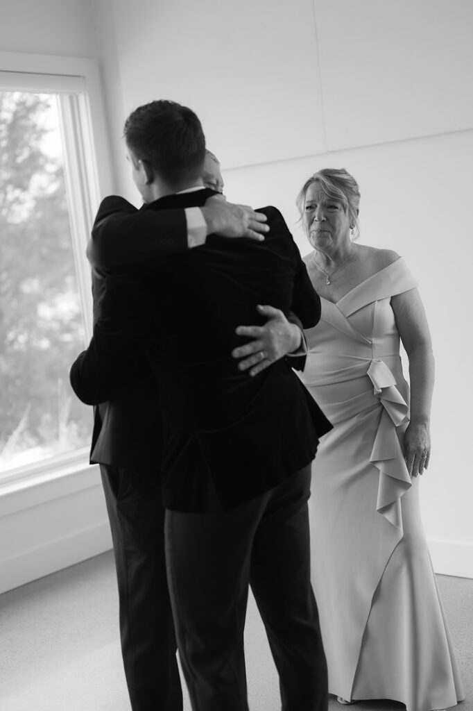 groom and parents first look