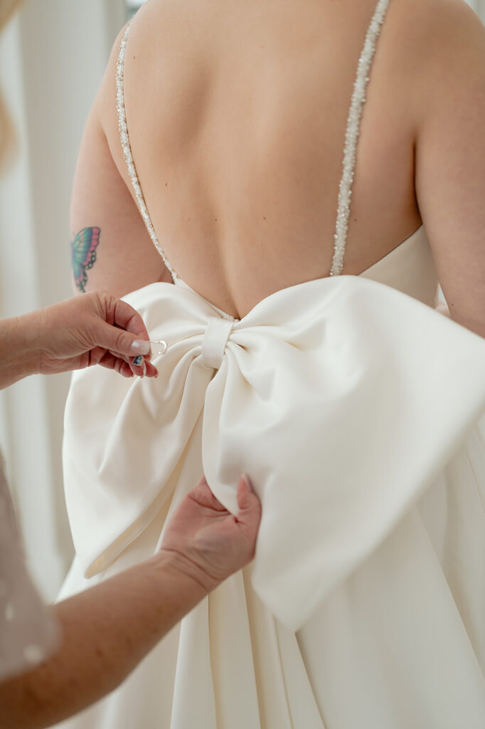 mom helping bride get ready for the big day
