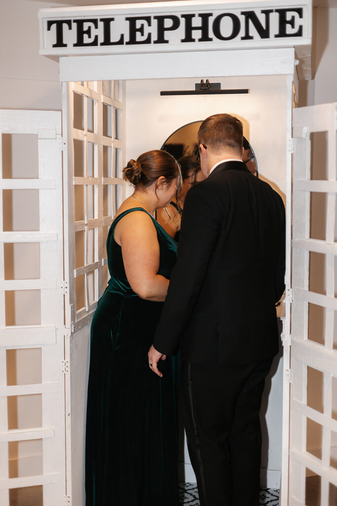 wedding guests at the wedding phone booth