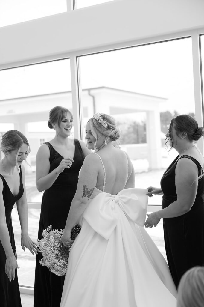 candid moment of bride and bridesmaids