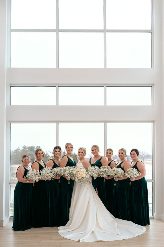 bride and bridesmaids, bridesmaids in green bridesmaid dresses for a winter wedding