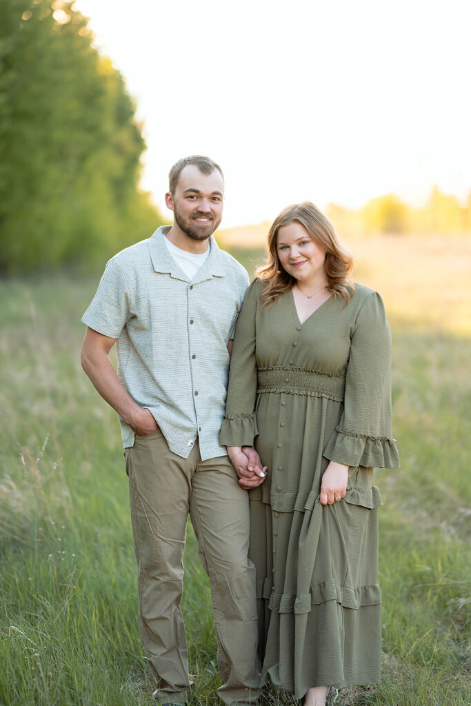 couple posing in a lush field in Minnesota
