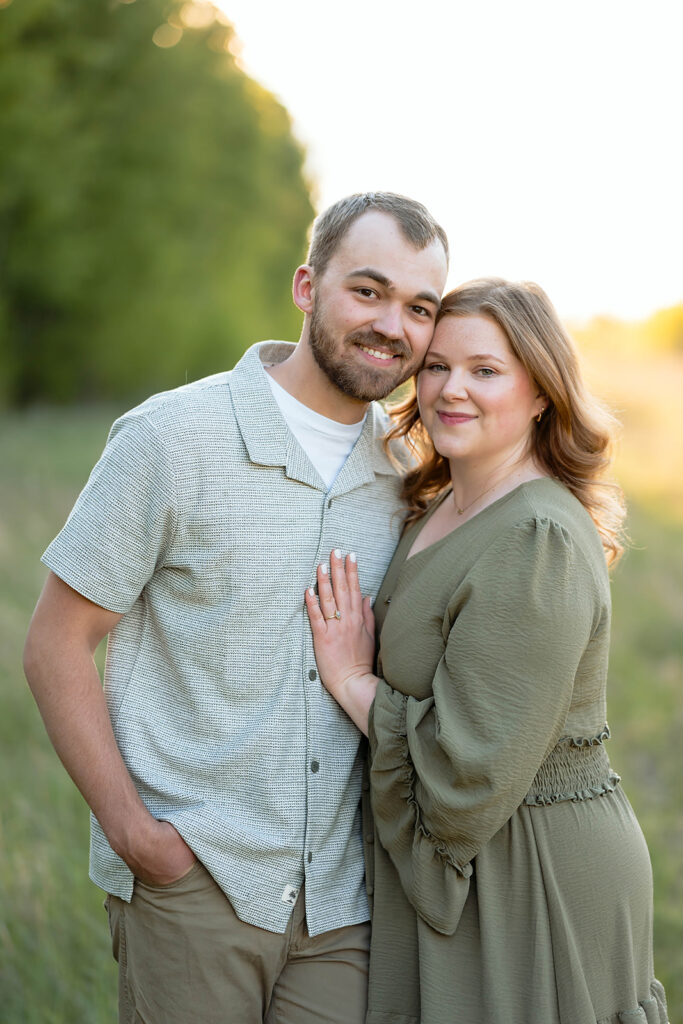 couple posing in a lush field in Minnesota