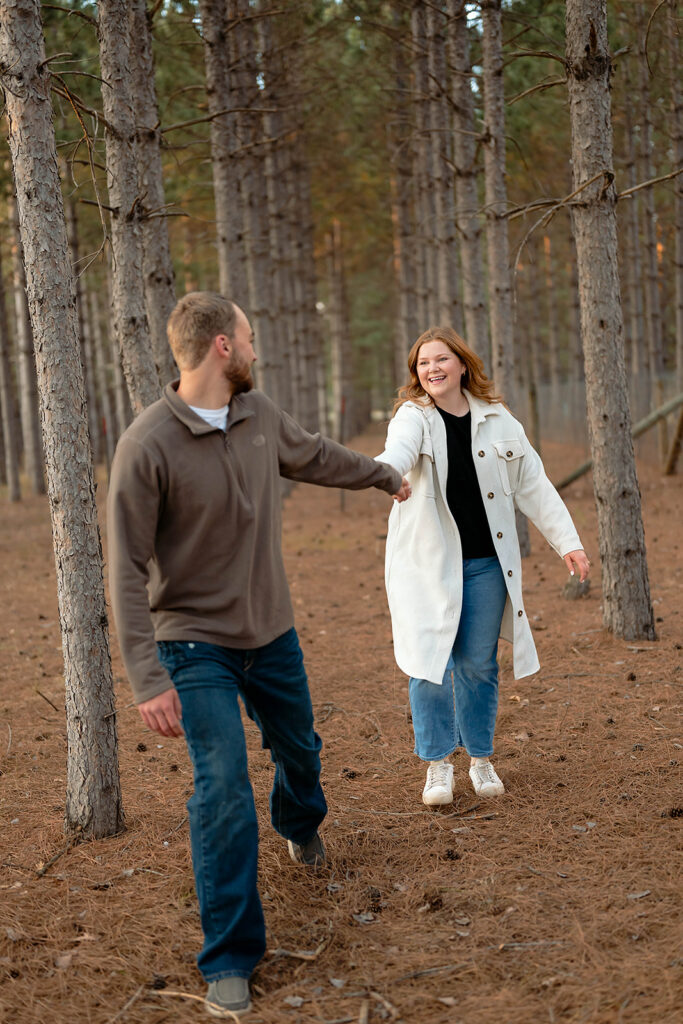 playful couple in a forest