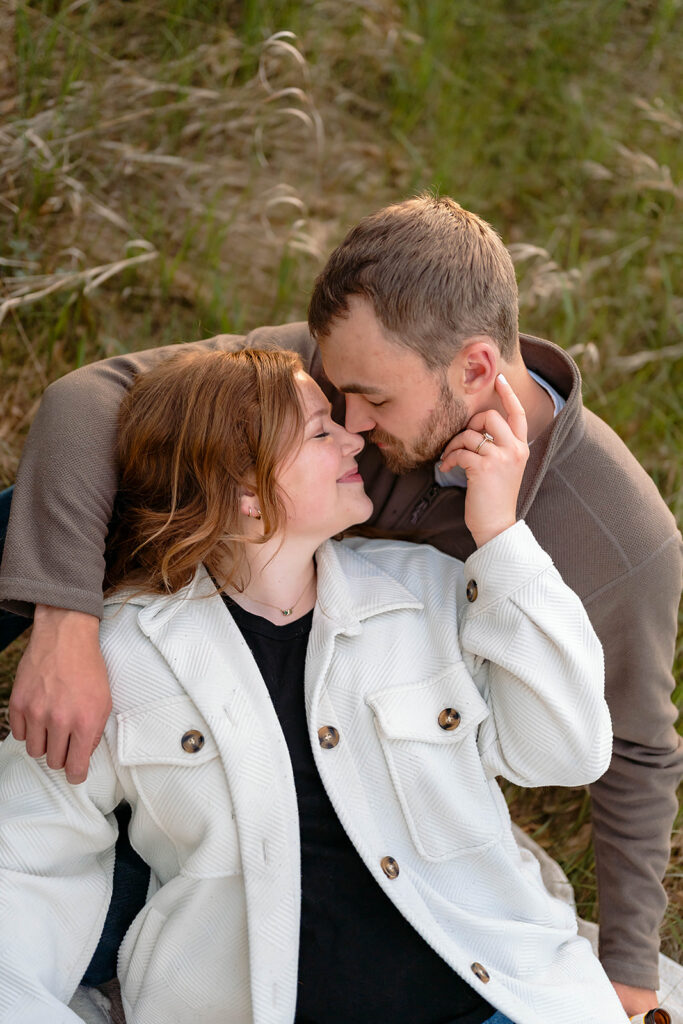 couple in a lush field during golden hour in minnesota