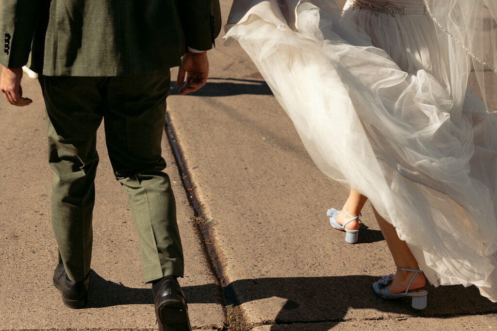 romantic bride and groom wandering in downtown minneapolis 