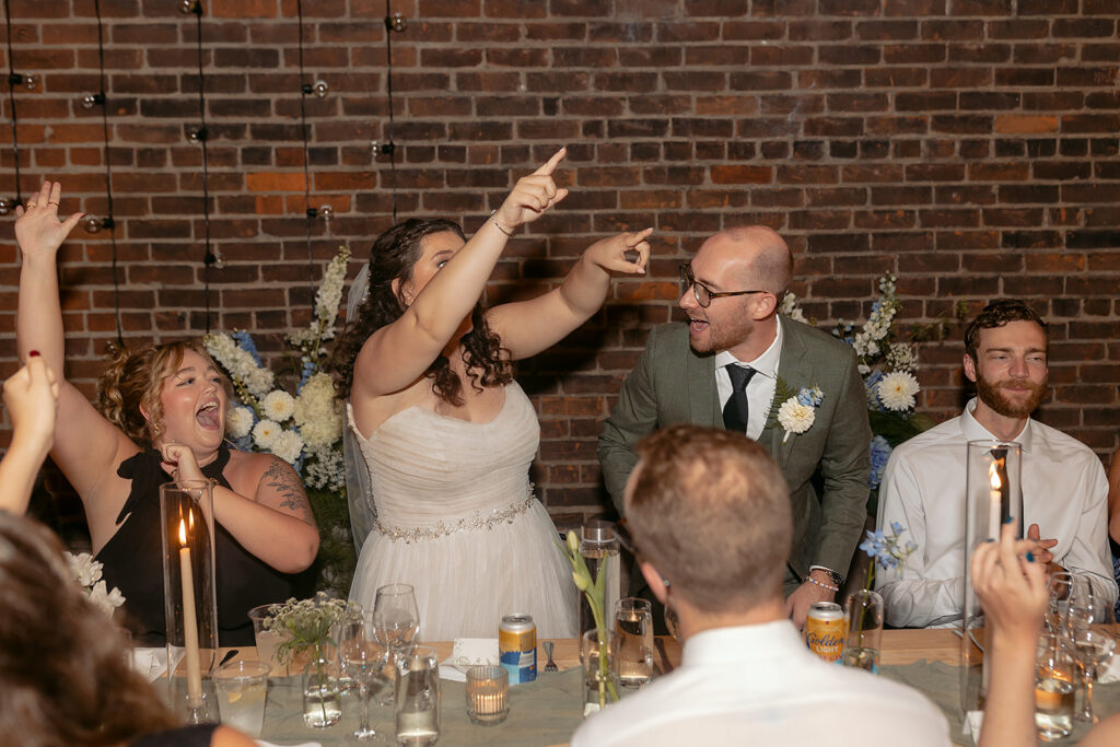bride and groom having fun during the wedding reception at the neu neu wedding venue
