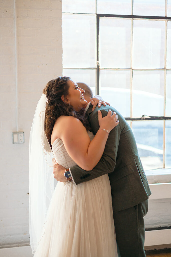 emotional bride and groom first look at the neu neu wedding venue