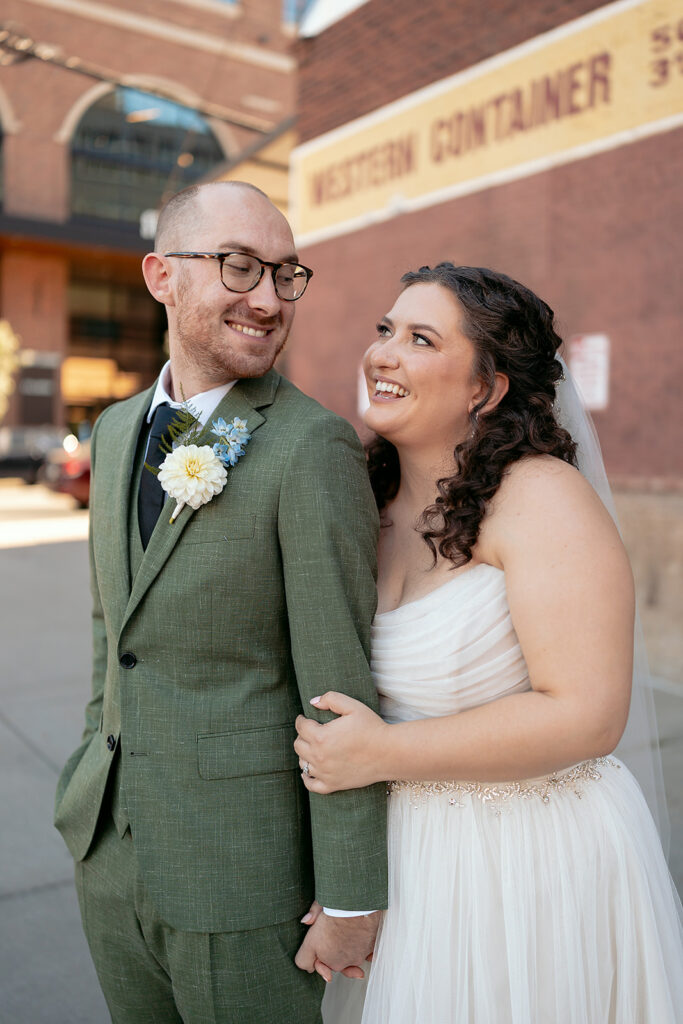 romantic bride and groom wandering in downtown minneapolis 