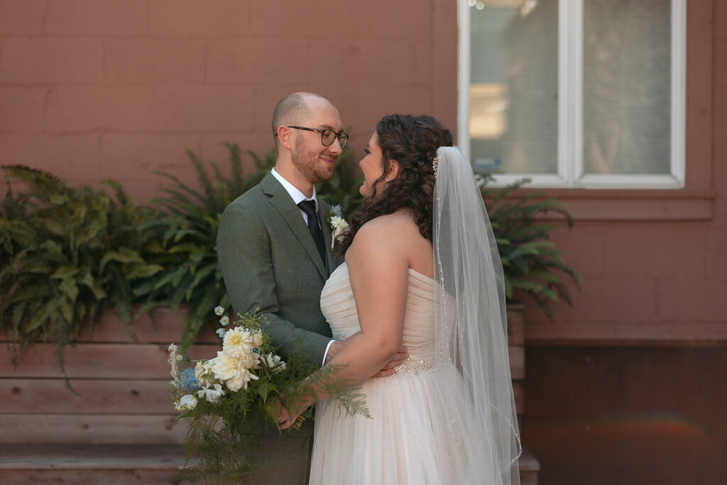 romantic bride and groom wandering in downtown minneapolis 