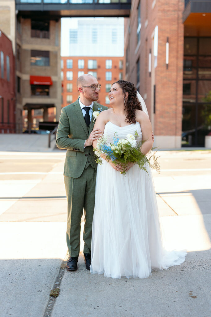 romantic bride and groom wandering in downtown minneapolis 