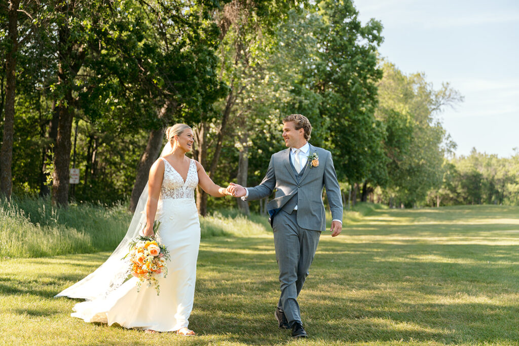 bride and groom at the golf course during their bemidji country club wedding day