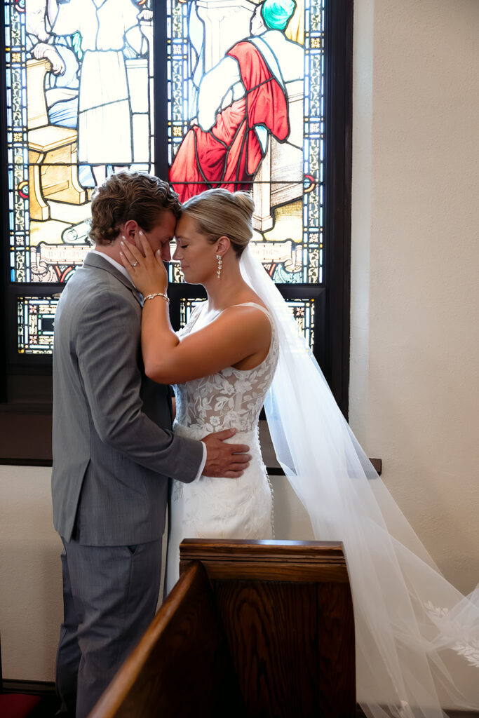 moody bride and groom portraits at the church
