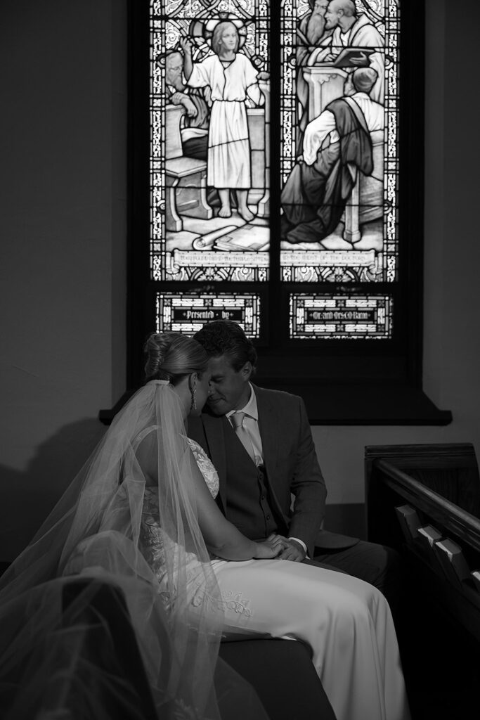 moody bride and groom portraits at the church