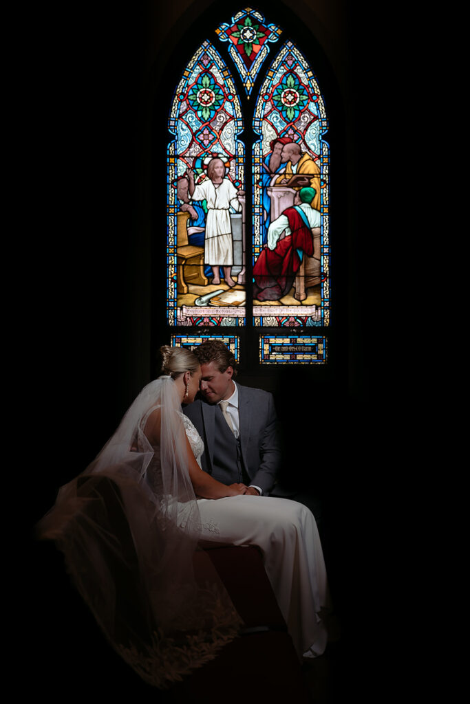 moody bride and groom portraits at the church