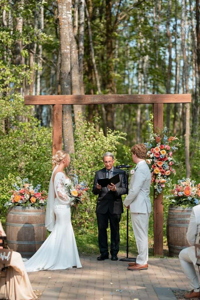 outdoor wedding ceremony with colorful spring florals