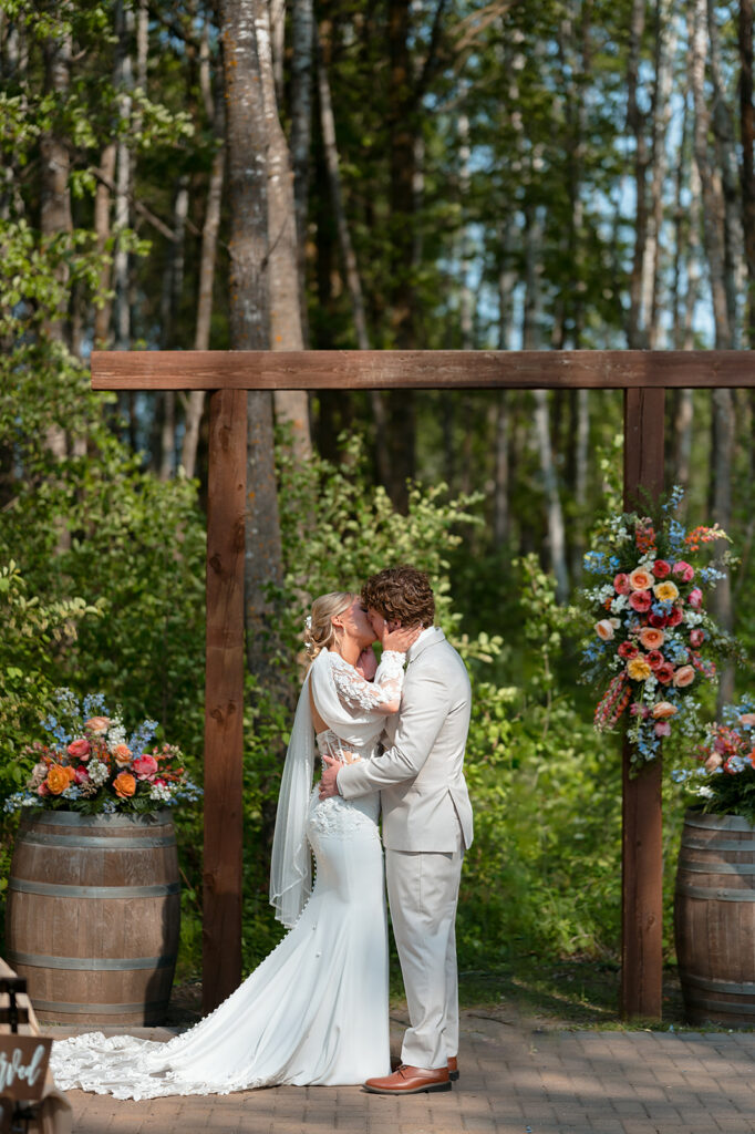 outdoor wedding ceremony with colorful spring florals