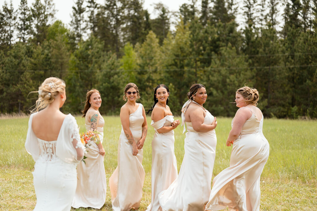 candid and emotional bride and bridesmaids first look