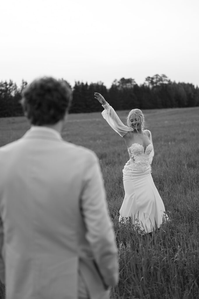 dreamy bride and groom moments in a lush green field during a spring wedding at bluebelle event venue