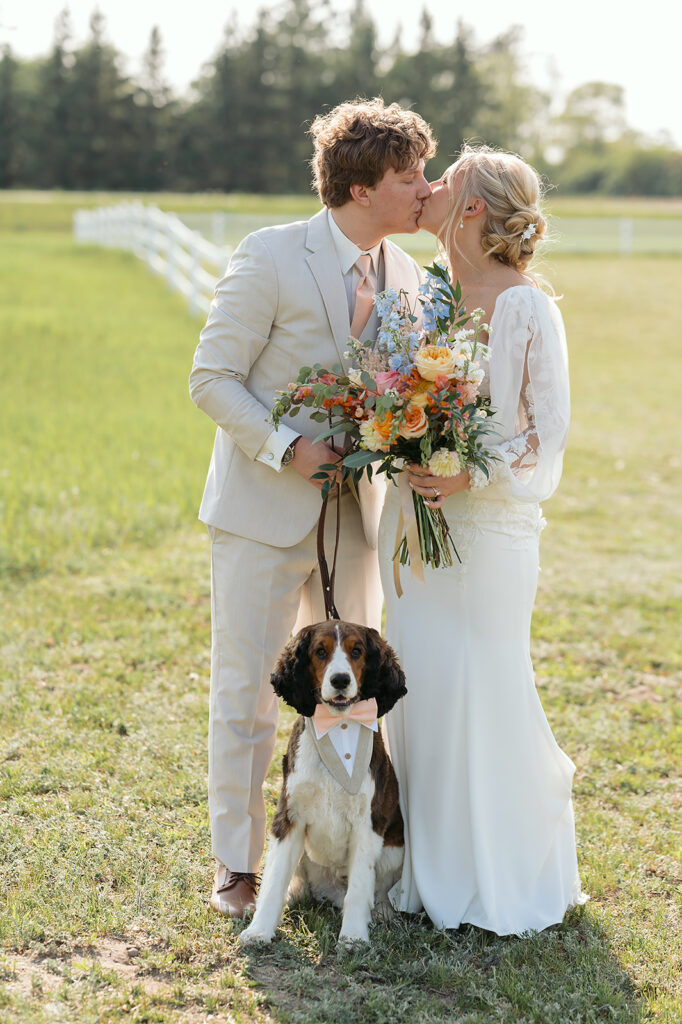 dreamy bride and groom moments in a lush green field during a spring wedding at bluebelle event venue