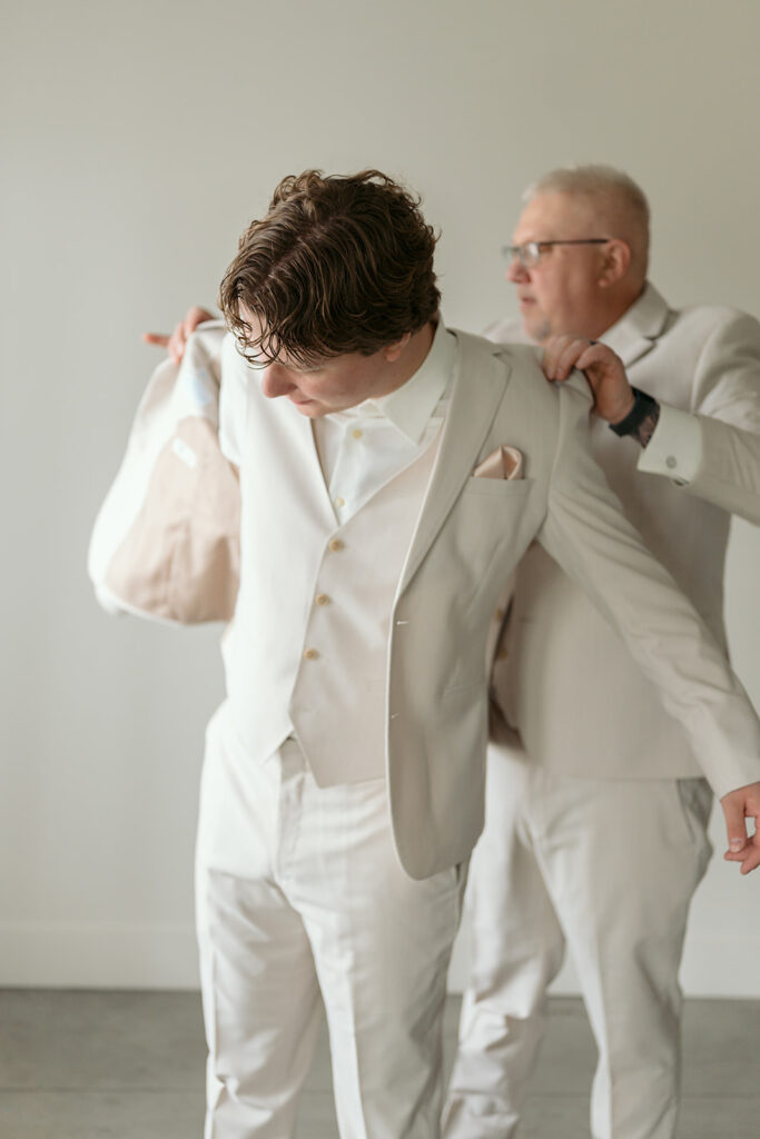 groom getting ready at the bluebelle event venue space