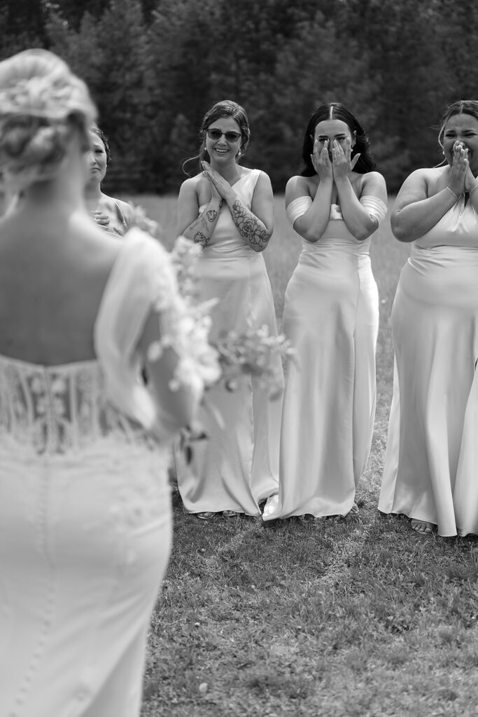 candid and emotional bride and bridesmaids first look