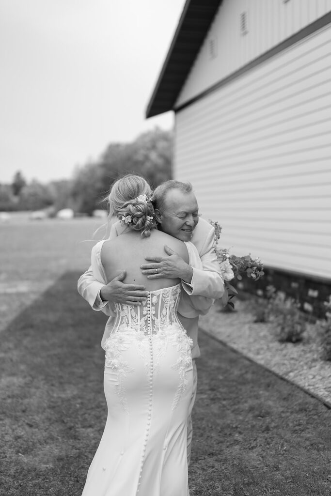 candid bride and dad first look
