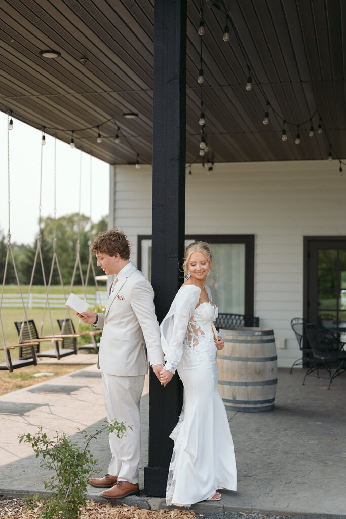 bride and groom first touch and private vow exchange during their spring wedding at bluebelle event venue