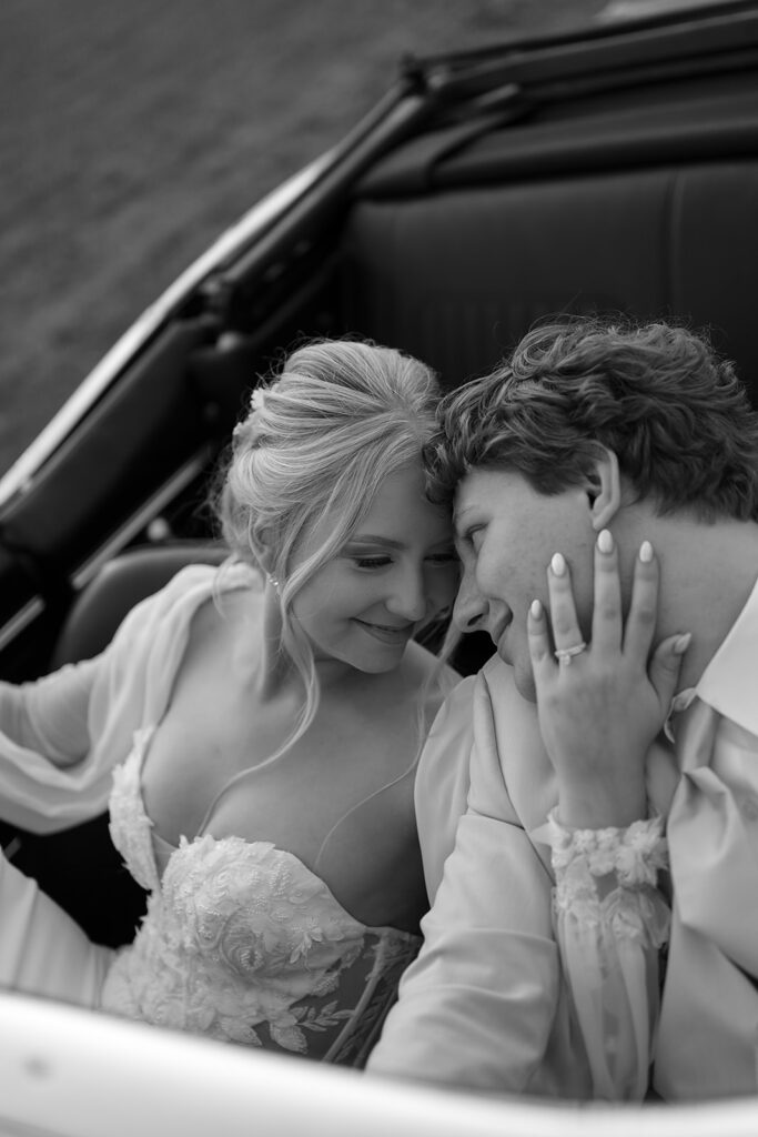 bride and groom in a vintage car during golden hour portraits