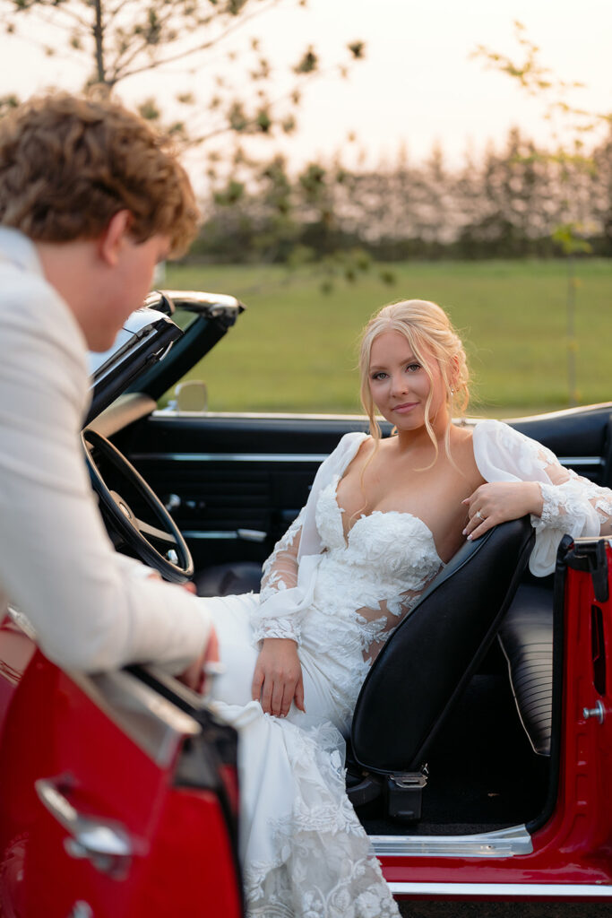 bride and groom in a vintage car during golden hour portraits