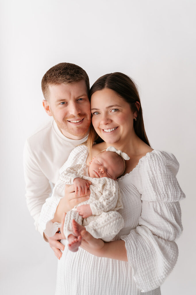 family and newborn baby in a light timeless studio in bemidji mn