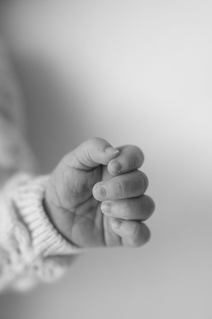 close up of the tiny newborn baby hand