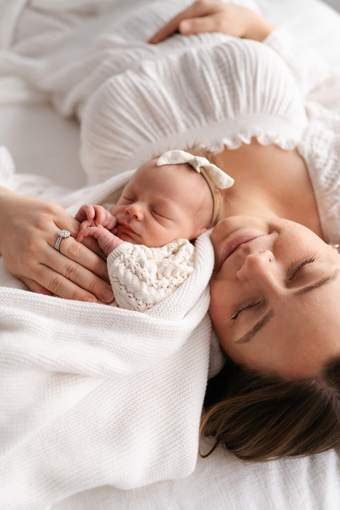 mom and newborn baby in a light timeless studio in bemidji mn