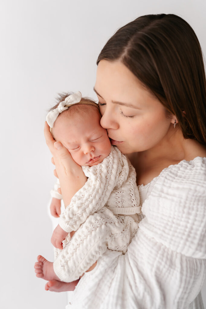 mom and newborn baby in a light timeless studio in bemidji mn