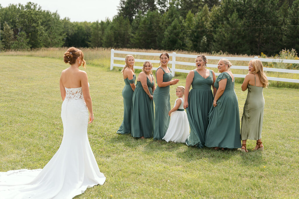 bride and bridesmaids first look