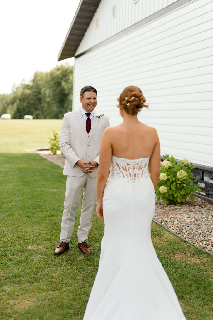 emotional bride and dad first look